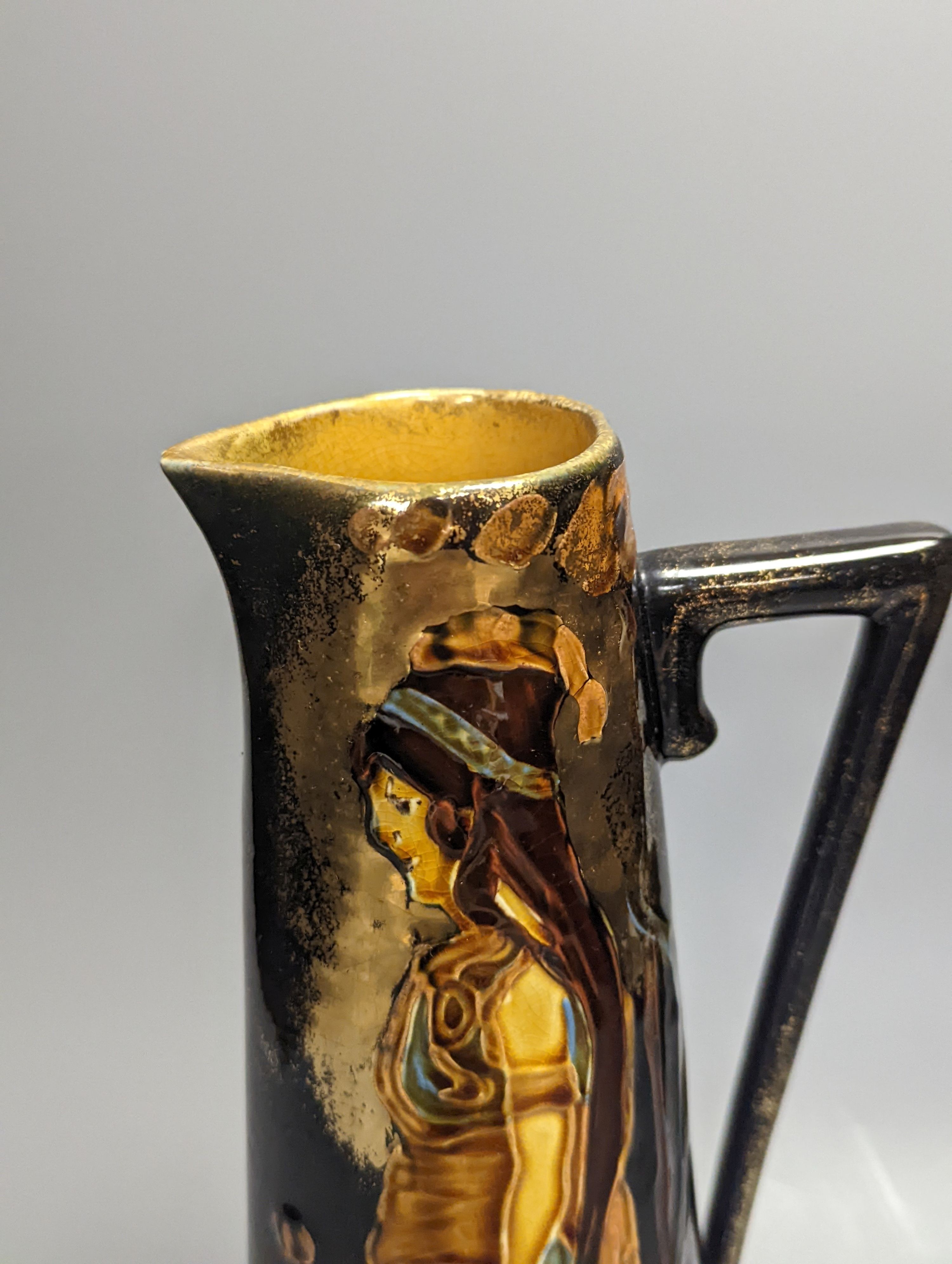 An Art Nouveau earthenware tapering jug, height 30cm